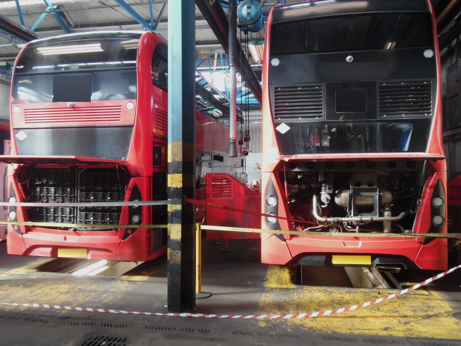 Buses parked inside a bus garage
